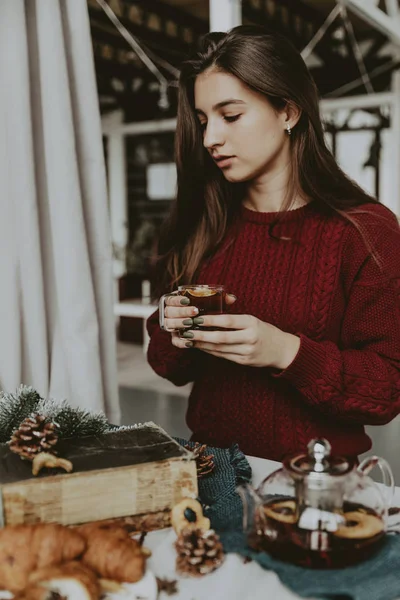 rink Tea relax cosy photo with blurred background. Female hands holding mug of hot Tea in morning. Young woman relaxing tea cup on hand. Good morning Tea or Have a happy day message concept