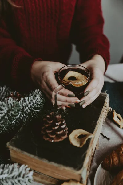 rink Tea relax cosy photo with blurred background. Female hands holding mug of hot Tea in morning. Young woman relaxing tea cup on hand. Good morning Tea or Have a happy day message concept