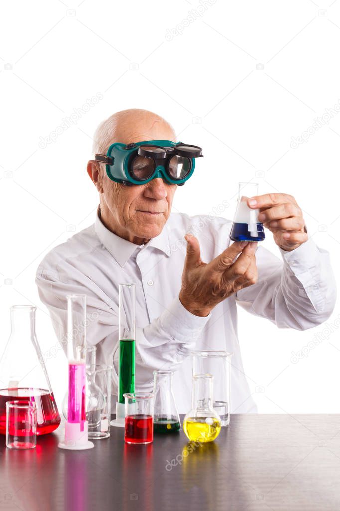 Funny professor with protective glasses and test tube