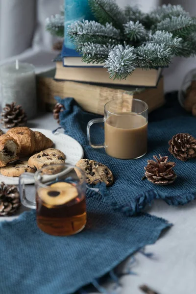 Closeup on the table biscuits, tea, coffee, cones. — Stock Photo, Image