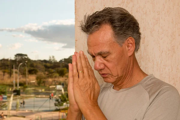 Man His Balcony Hands Folded Offering Prayer — Stock Photo, Image