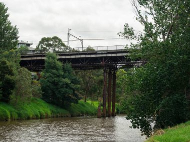 Melbourne, Australia - February 24, 2017: Victoria Bridge is a steel truss bridge over the Yarra River between Hawthorn and Richmond. It was built in 1884. clipart