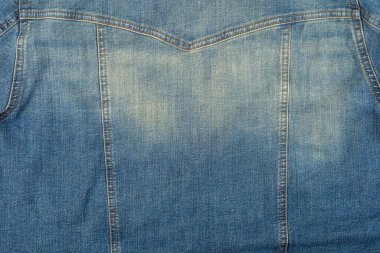 Denim doku bağbozumu arka planı. Kot ceketin arkasında..