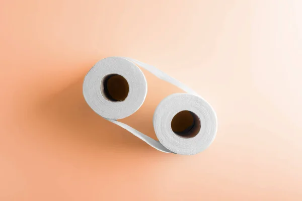 Two Roll Toilet Paper Peach Color Paper Background Hygiene Bathroom — Stock Photo, Image