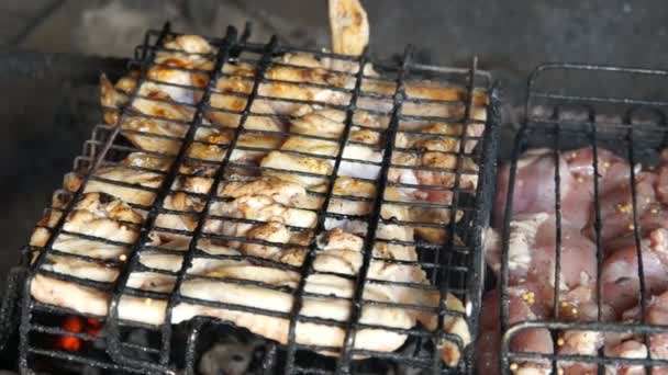 Grilling Chicken on BBQ. Grilled chicken on the grill. Chicken meat cooking on a barbecue grill — Stock Video