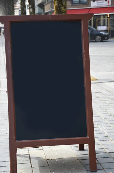 Empty menu board on street