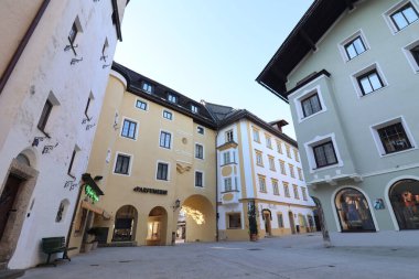 KITZBUEHEL, AUSTRIA - AUGUST 8, 2025: Historic town square with traditional alpine buildings and arcades in the old town of Kitzbuehel. High quality photo
