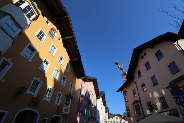 KITZBUEHEL, AUSTRIA - AUGUST 8, 2025: Colorful historic buildings with traditional alpine architecture in the old town of Kitzbuehel. High quality photo
