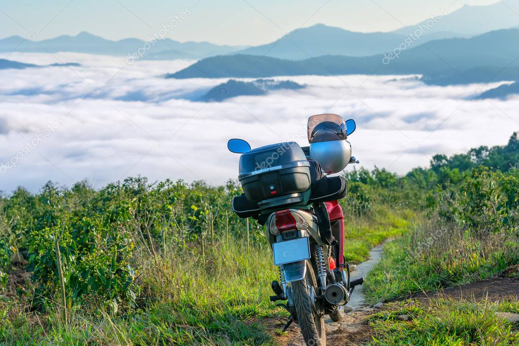 Motorcycle adventure with baggage storage bins behind and photographic instruments. This is a friend of the long trip of travel enthusiasts love to explore the beauty of nature