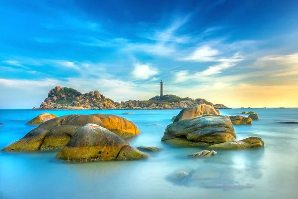 Ke Ga Lighthouse sunset with surf patted smoother reefs create clouds on the sea as this is the only ancient lighthouse is located on the island in Vietnam