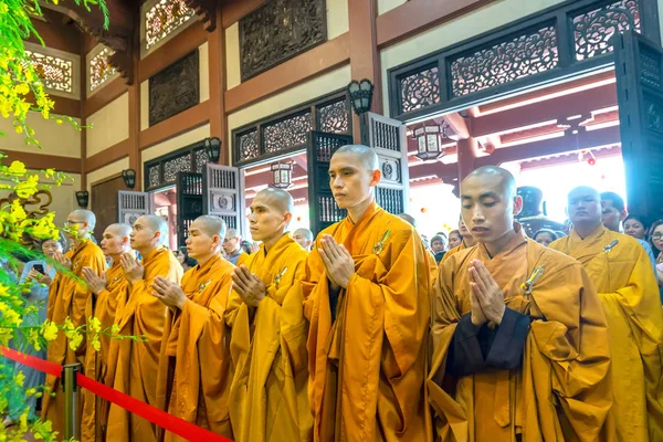 Ho Chi Minh City, Vietnam - May 29, 2018: Buddhist monk praying Buddha in Buddha's birthday celebrations being held in temple morning as a ritual of traditional culture in Ho Chi Minh city, Vietnam