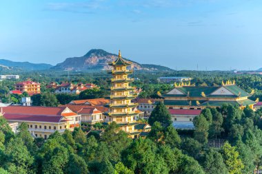 VUNG TAU, VIETNAM - September 30th, 2018: The architectural stupa at Dai Tong Lam pagoda attracts tourists to visit spirit of spiritual relaxation and relaxation at the weekend in Vung Tau, Vietnam clipart
