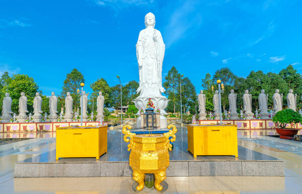 Vung Tau, Vietnam - September 30th, 2018: Beauty architecture leads to Lord Buddha statue shining in Dai Tong Lam Pagoda, which attracts tourists to visit spiritually on weekends in Vung Tau, Vietnam