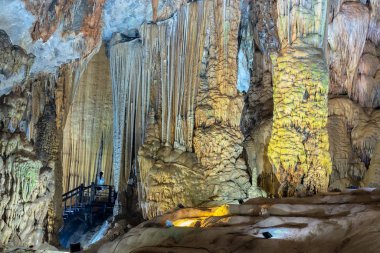 Cave-shaped limestone geological formations with beautiful stalactites and stalagmites create spectacular features in the natural world clipart