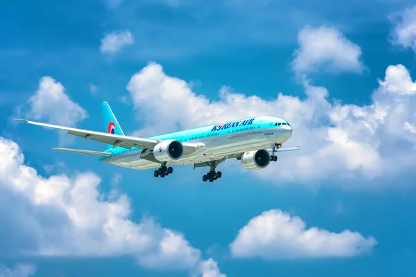 Ho Chi Minh City, Vietnam - June 1st, 2019: Passenger aircraft Boeing 737 of Korean Air flying through clouds sky prepare to landing at Tan Son Nhat International Airport, Ho Chi Minh City, Vietnam