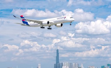 Ho Chi Minh City, Vietnam - June 18th, 2019: Passenger airplane Airbus A350 of LATAM Airlines  flying over urban prepare to landing at Tan Son Nhat International Airport, Ho Chi Minh City, Vietnam clipart