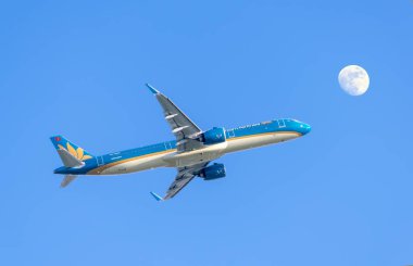 Ho Chi Minh City, Vietnam - September 11th, 2019: Airplane airbus A321 of Vietnam Airlines flying through sky prepare to landing at Tan Son Nhat International Airport, Ho Chi Minh City, Vietnam clipart