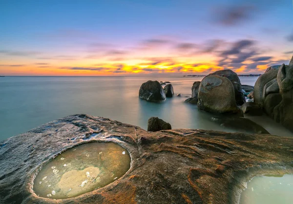 Sunset with circular reef filled water as the dragon eye, the distance dramatic sky with colorful farewell to a beautiful day