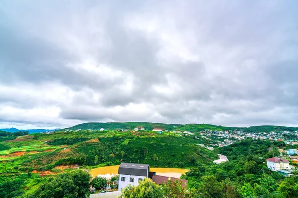 Small town on a stormy morning with moving clouds on the top of the hill and the valley is the peaceful in Da Lat, Vietnam