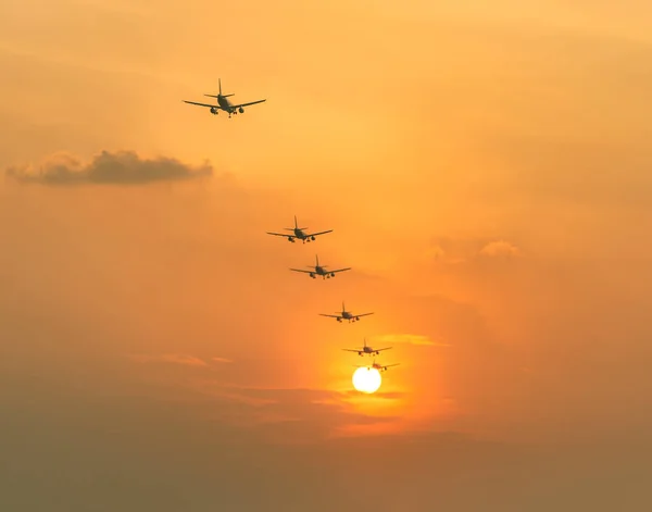 Airplane landing at sunset sky. Sunset is always the magic of photography