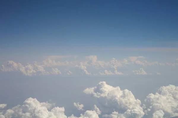 Clouds and blue sky seen from plane — Stock Photo, Image