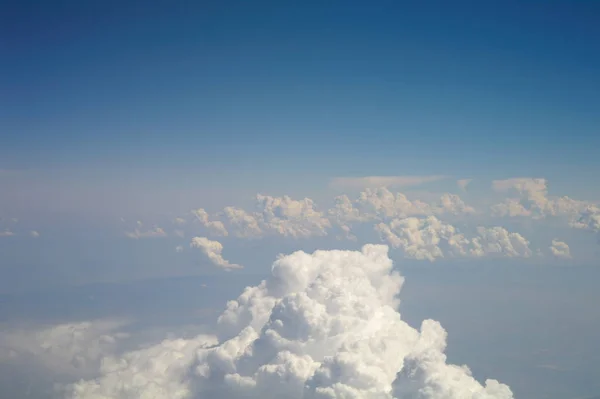 Clouds and blue sky seen from plane — Stock Photo, Image