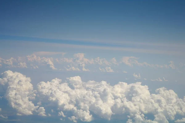 Clouds and blue sky seen from plane — Stock Photo, Image