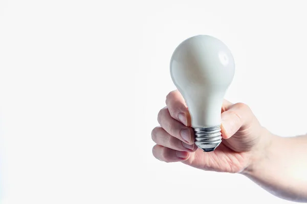 Man holding a light bulb — Stock Photo, Image