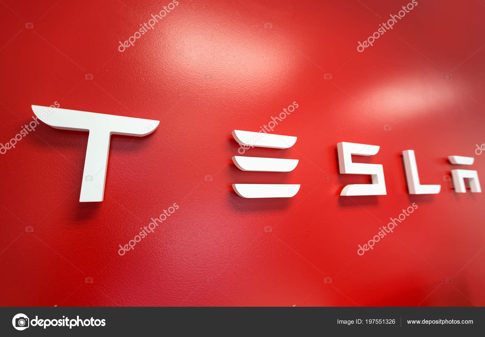 Tesla Sign On The Wall Inside A Tesla Store Stock Editorial