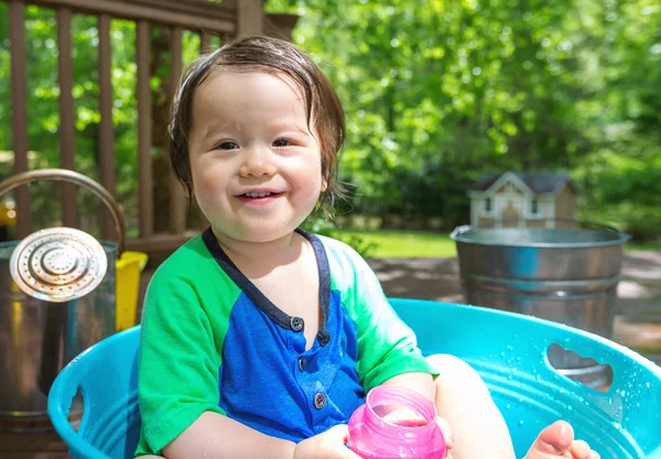 Young toddler boy playing with water — Stock Photo, Image