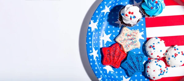 American flag plate with desserts on white — Stock Photo, Image