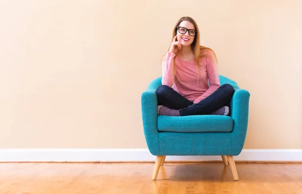 Happy young woman smiling in a big open room — Stock Photo, Image