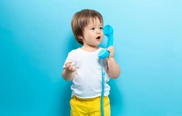 Toddler boy with an old fashioned phone — Stock Photo, Image