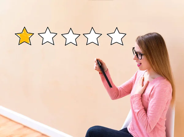 One Star Rating with woman using a tablet — Stock Photo, Image