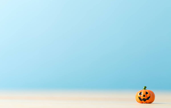 Tiny Halloween pumpkin on a table