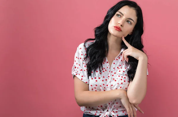 Mujer joven en una pose reflexiva — Foto de Stock