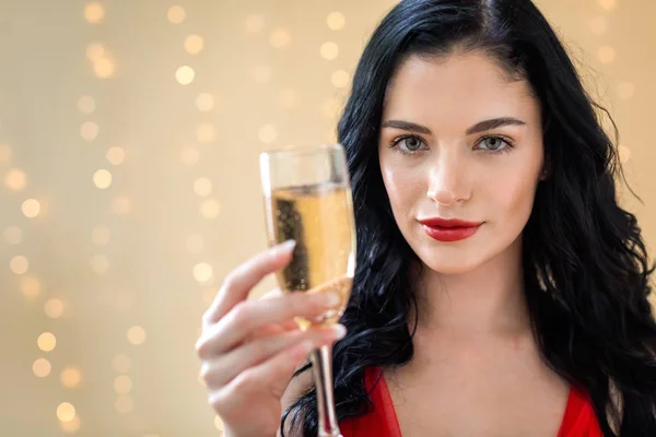 Young woman holding a champagne flute — Stock Photo, Image