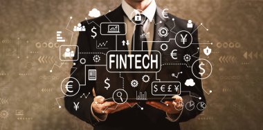 Bir tablet bilgisayar tutan işadamı ile fintech Tema 