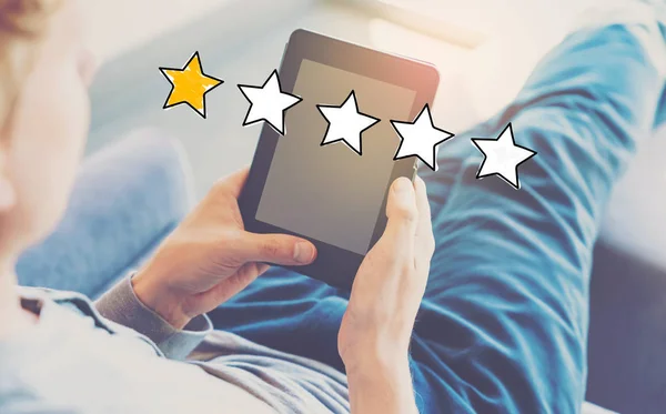 One Star Rating with man using a tablet — Stock Photo, Image
