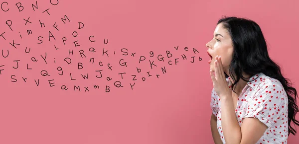 Alphabet letters with young woman speaking