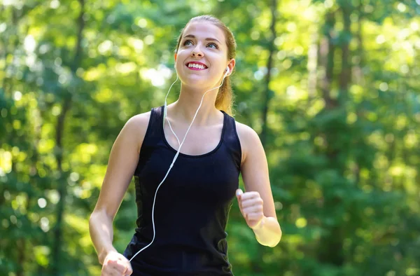 Athletic young woman jogging Stock Photo