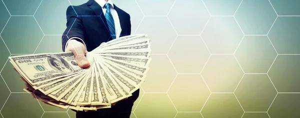 ビジネスの男性と現金を持つ六角形グリッド — ストック写真