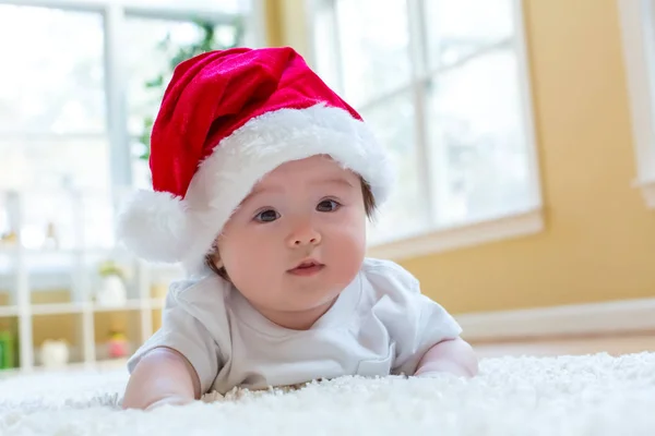 Baby boy with a Santa hat on Christmas — Stock Photo, Image