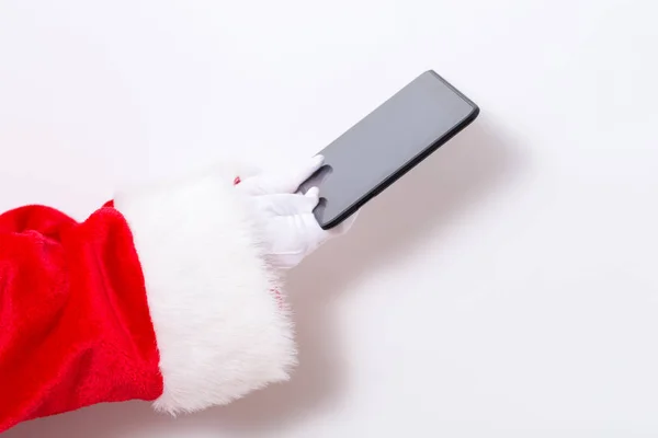 Papai Noel segurando um computador tablet — Fotografia de Stock