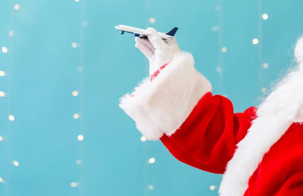 Santa holding a toy airplane — Stock Photo, Image