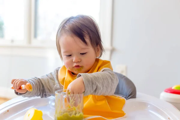 Toddler boy eating a meal — Stock Photo, Image