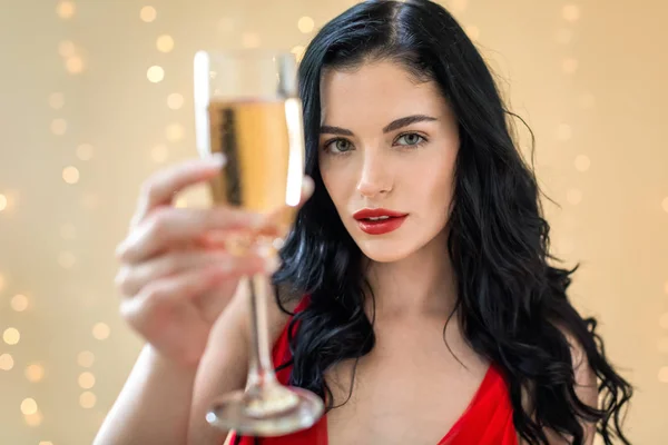 Young woman holding a champagne flute — Stock Photo, Image