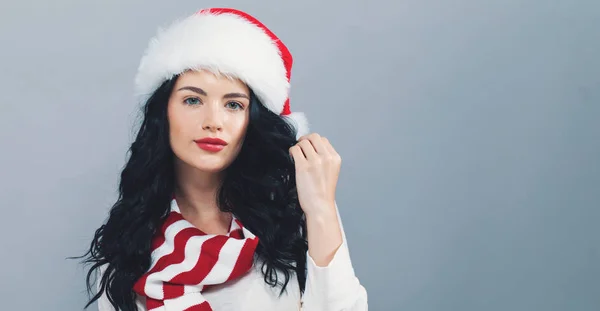 Happy woman with a Santa hat — Stock Photo, Image