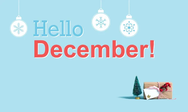 Hello December message with Christmas gift box and tree — Stock Photo, Image