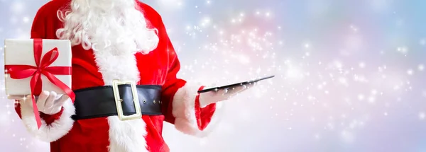 Babbo Natale con un tablet — Foto Stock